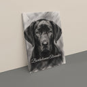 A black-and-white dog portrait canvas leans against a beige studio wall.