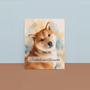A watercolor dog portrait canvas rests against a blue studio backdrop.