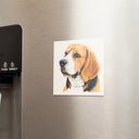 A beagle portrait magnet is displayed beside a refrigerator water dispenser.