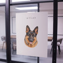 A watercolor German shepherd poster is displayed on an office glass wall.