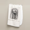 A memorial dog portrait blanket with a name and dates is draped against a beige backdrop.
