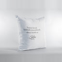 The back of a white Kiko memorial pillow shows a tribute, name and dates.