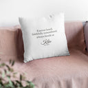 The back of a Kiko memorial pillow shows a tribute, name and dates on a pink sofa.
