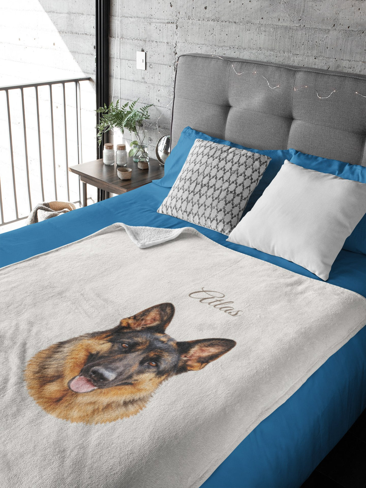 Watercolor German shepherd portrait printed on a blanket spread across a bed